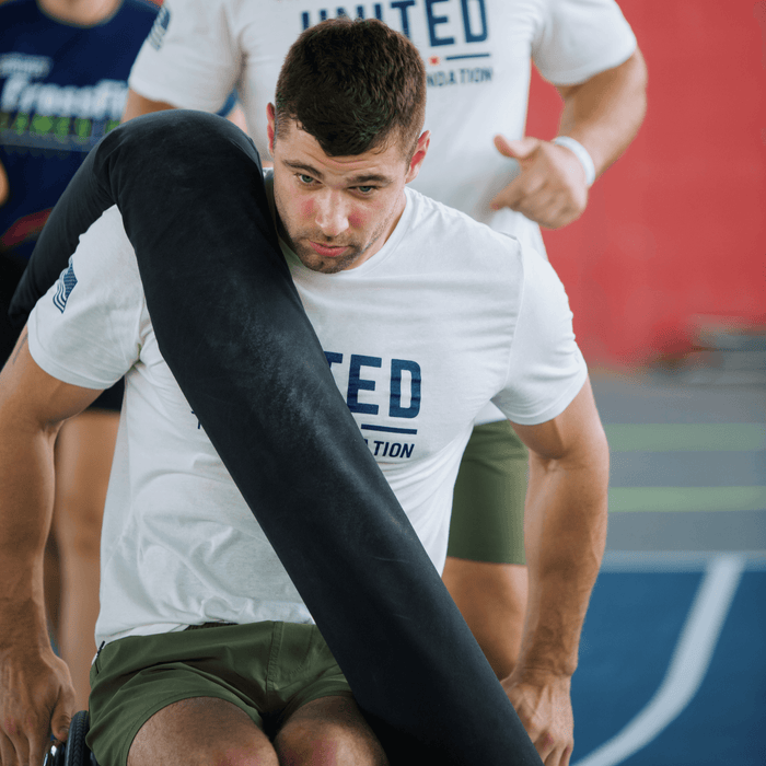 Detail pf Equip Products CrossCarry Sandbag in use in a competition by an athlete using a wheelchair.