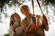 Two people holding gardening shears in a garden setting using EaZyHold products.