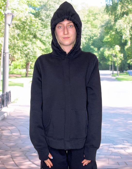 Person wearing a Sense-ational You QuietSense Sound Reducing Sensory Navy Hoodie outdoors on a sunny day