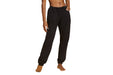 Front angle of a model wearing Slick Chicks Adaptive Fitted Lounge Joggers in black against a white background