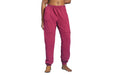 Front angle of a model wearing Slick Chicks Adaptive Fitted Lounge Joggers in plum against a white background