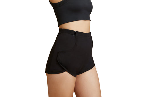 Side angle of a model wearing Slick Chicks Adaptive Lounge Short in black against a white background