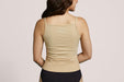 Back angle of a model wearing Slick Chicks Adaptive Two-Way Front Zip Cami in beige, against a plain white background