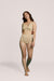 A model wearing Slick Chicks Adaptive Leakproof Underwear in beige against a plain light beige studio background