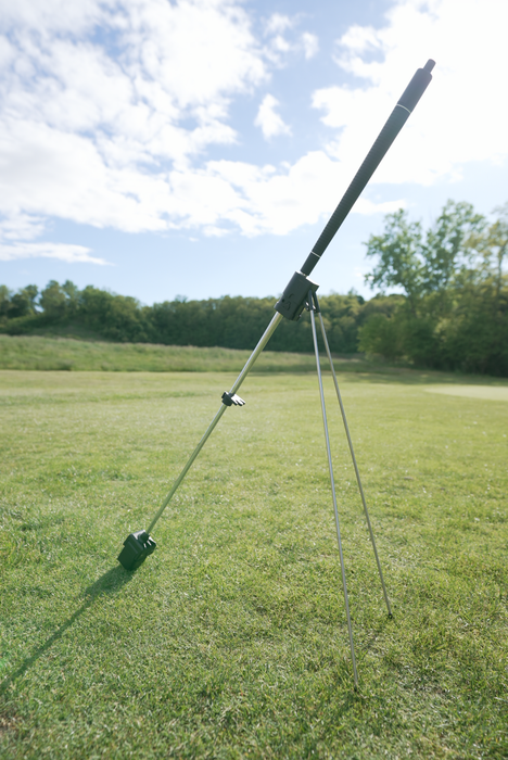 Tee Tender Adaptive Golf Ball Teeing Device standing on a golf course