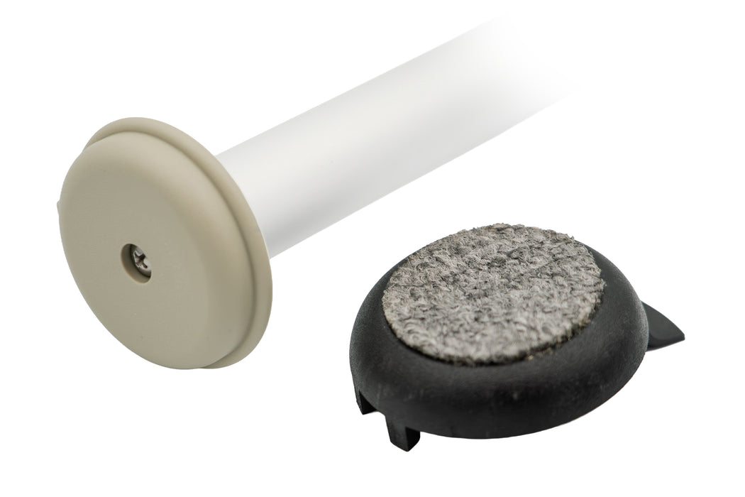 Versa Coast tan base puck fitted in the end of a silver walker leg with its Phillips screw showing, beside the removed black coaster turned up to show its gray carpeted pad on a white background