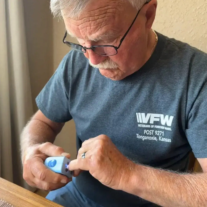 Veteran using Lil Nipper adaptive nail clipper by ClipDifferent