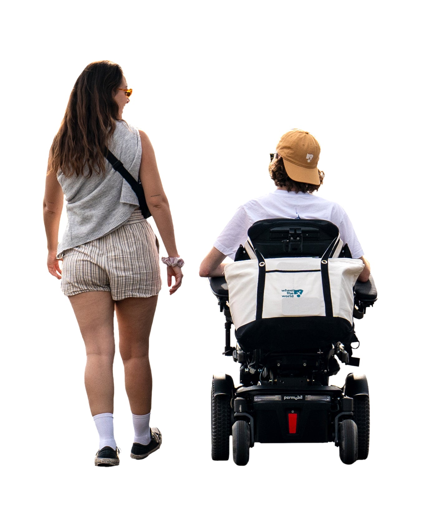 Woman and person in a power wheelchair traveling together.