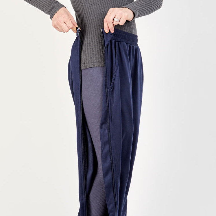 Side unzipped on the befree zipOns Adult Lightweight Adaptive Pants worn on model on a white background