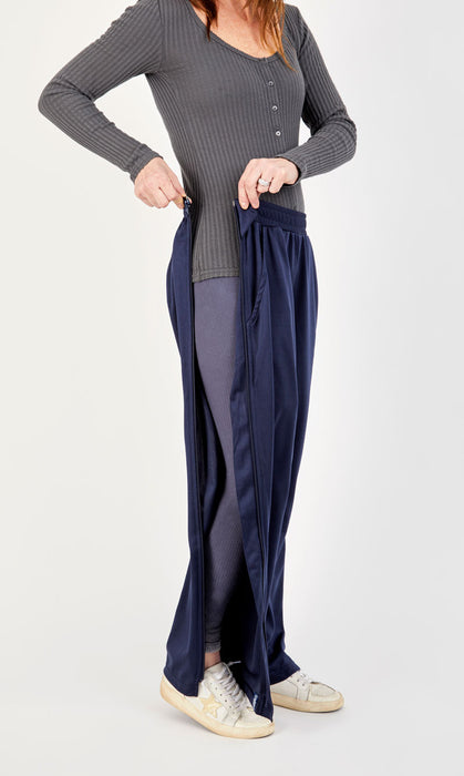Side unzipped on the befree zipOns Adult Lightweight Adaptive Pants worn on model on a white background
