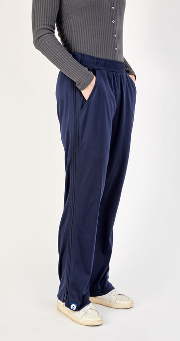 Side of befree zipOns Adult Lightweight Adaptive Pants worn on model on a white background