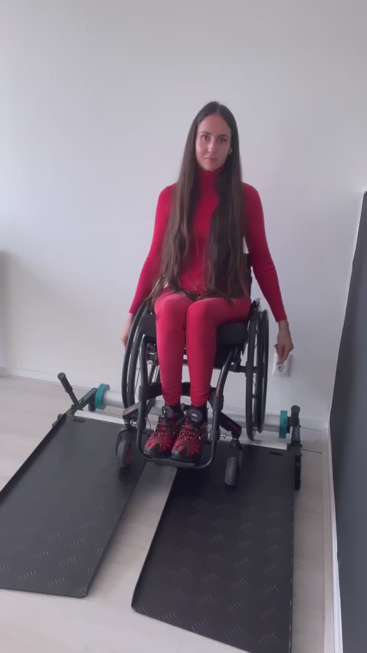 Person working out on the Invictus Active Wheelchair Trainer