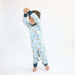 Child standing while wearing a Rainn Bamboo Critter Hollow Crescent Zipp Jammies on a white background