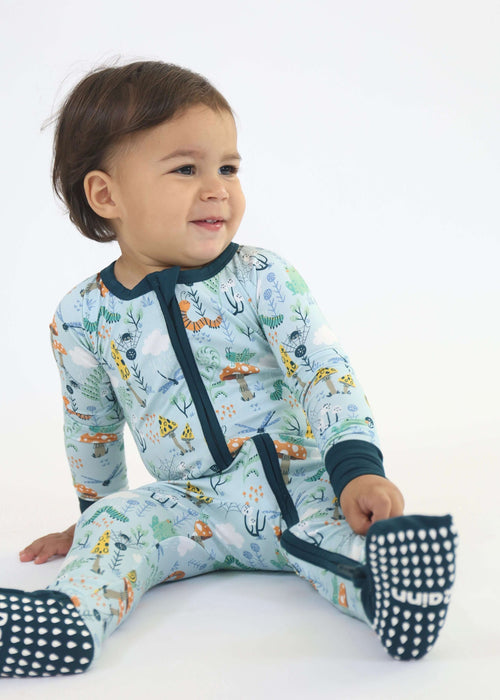 Baby wearing a Rainn Bamboo Critter Hollow Zipp Jammies on a white background