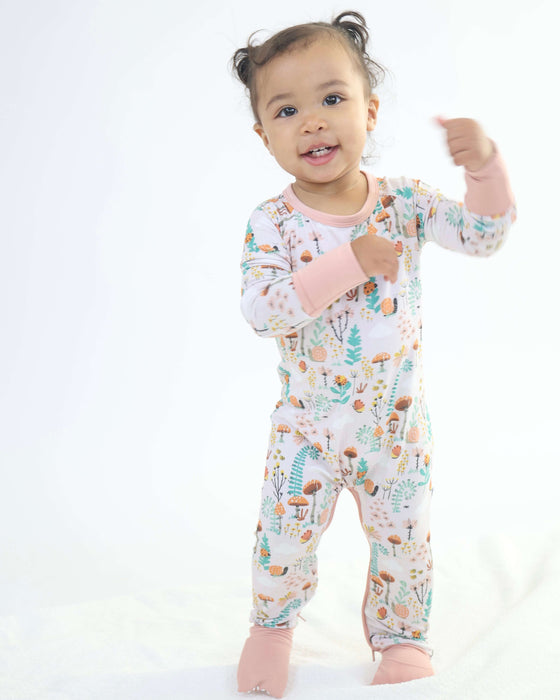 Child wearing a Rainn Bamboo Fern Crescent Zipp Jammies on a white background