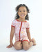 Child wearing a Rainn Bamboo Rainnbow Short Zipp Romper on a white background