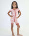 Child standing and wearing a Rainn Bamboo Rainnbow Short Zipp Romper on a white background