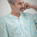 MagnaReady Untucked Short Sleeve Cooling Shirt with Magnetic Closures in Blue Leaf - lifestyle view